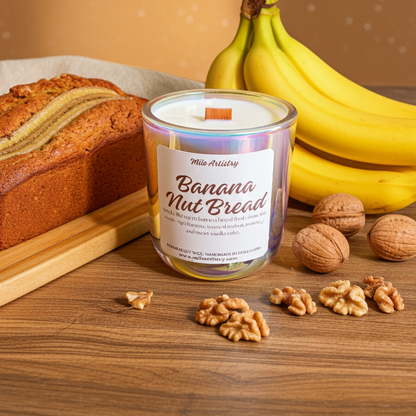 Banana Nut Bread candle with a loaf of bread, bananas, and walnuts on a wooden surface.