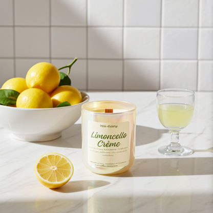 Candle labeled 'Limoncello Cèreme' next to a bowl of lemons and a glass of lemon juice on a marble surface.