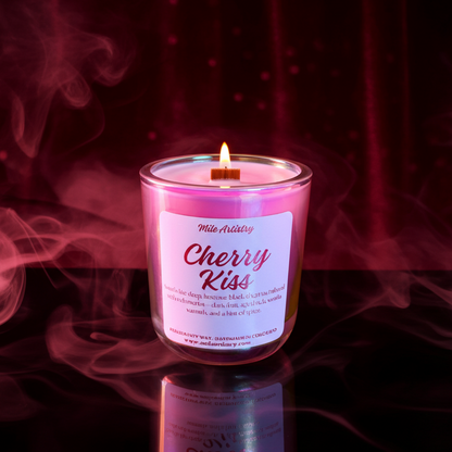 Candle labeled 'Cherry Kiss' with pink smoke effect on a dark background