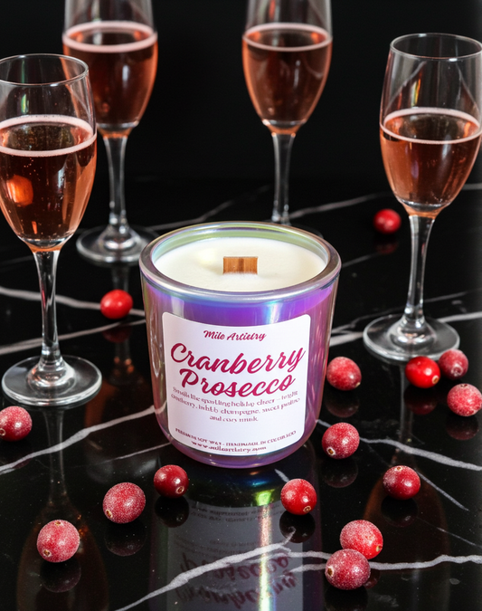 Cranberry Prosecco candle with cranberries and glasses of pink wine on a dark surface