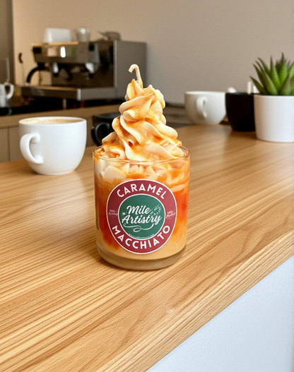Caramel macchiato drink in a glass with a visible brand label on a wooden counter.